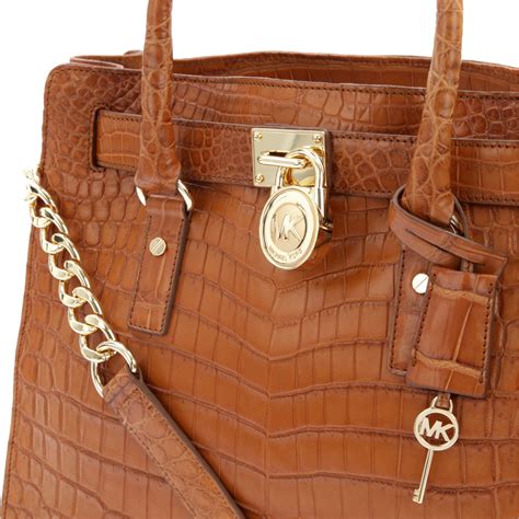 michael kors tote brown gold center|michael kors brown leather backpack.